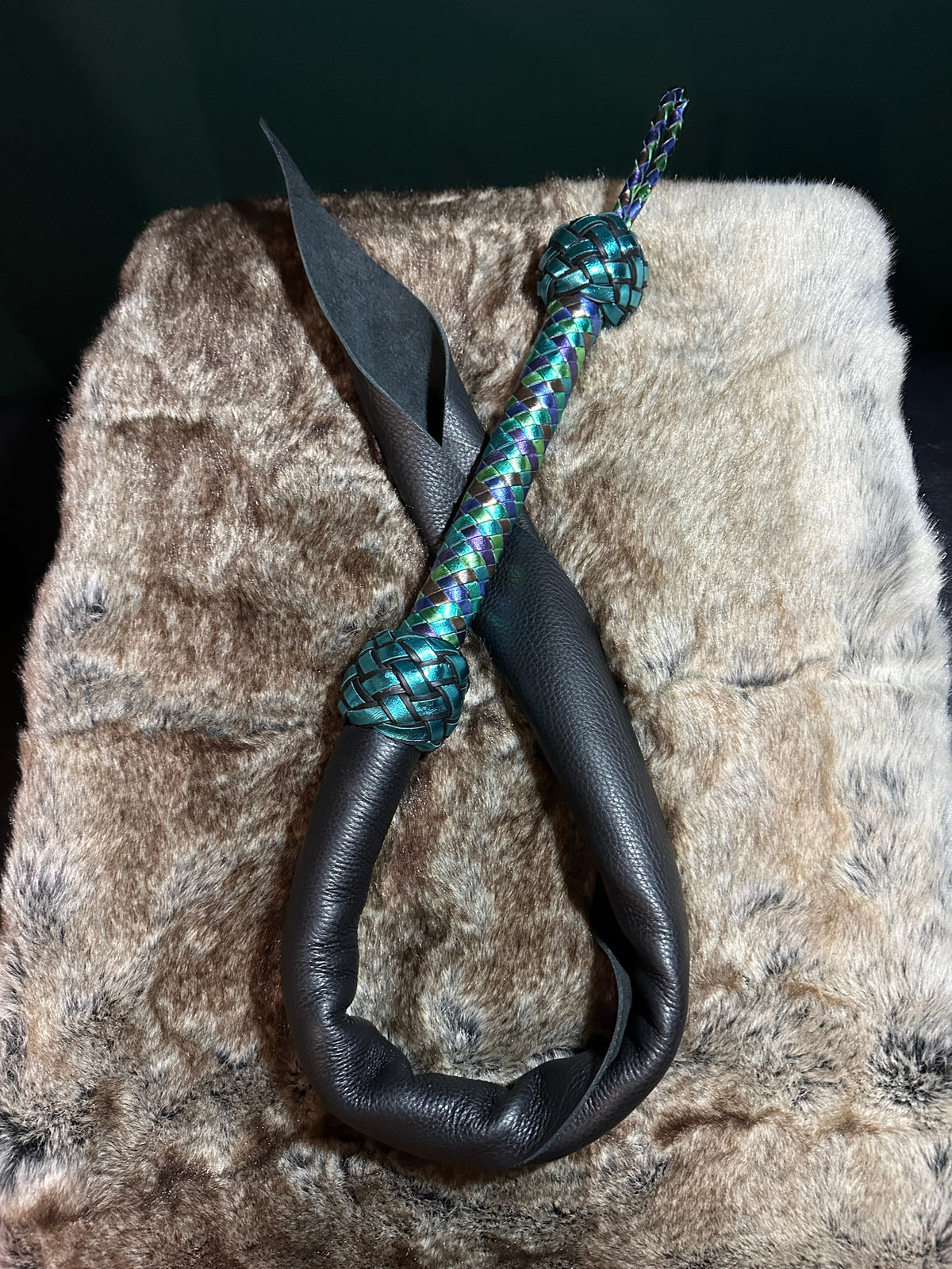 Black leather dragon tail looped over fur on a timber frame, Fire Breathers by Collared Foxy