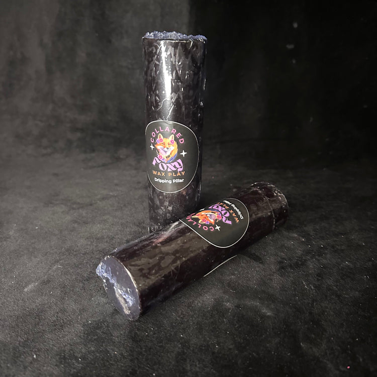 Black paraffin wax play candle on black velvet, An Tine by Collared Foxy