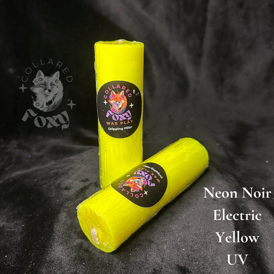 Electric yellow UV reactive paraffin dripping pillar candles on black velvet with Neon Noir label