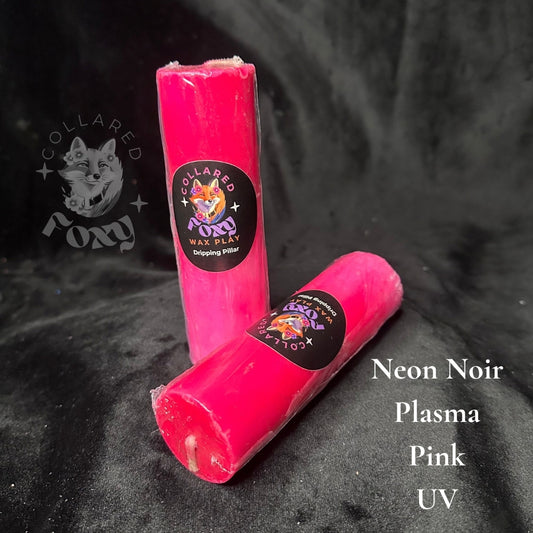 Plasma hot pink UV reactive paraffin dripping pillar candles on black velvet with Neon Noir label