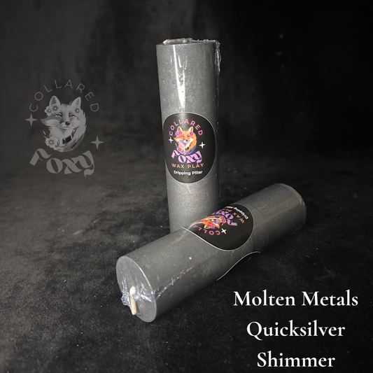 Quicksilver silver shimmer wax play candles, labelled, on black velvet